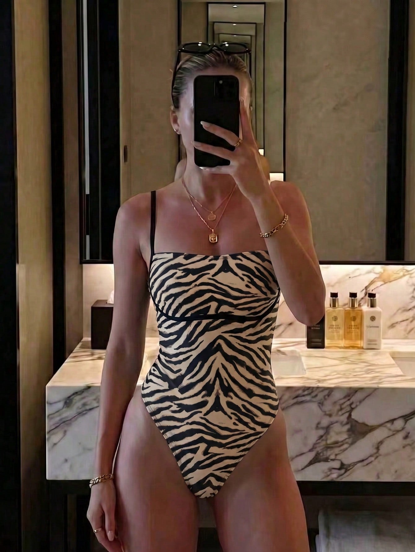 Black colorblock women's one-piece swimsuit with spaghetti straps and high stretch fabric.