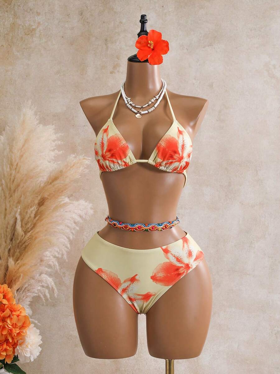 Women's black 3-piece bikini set featuring a halter triangle top with removable padding, high-waisted bottoms, and a knee-length mesh skirt with tie details.