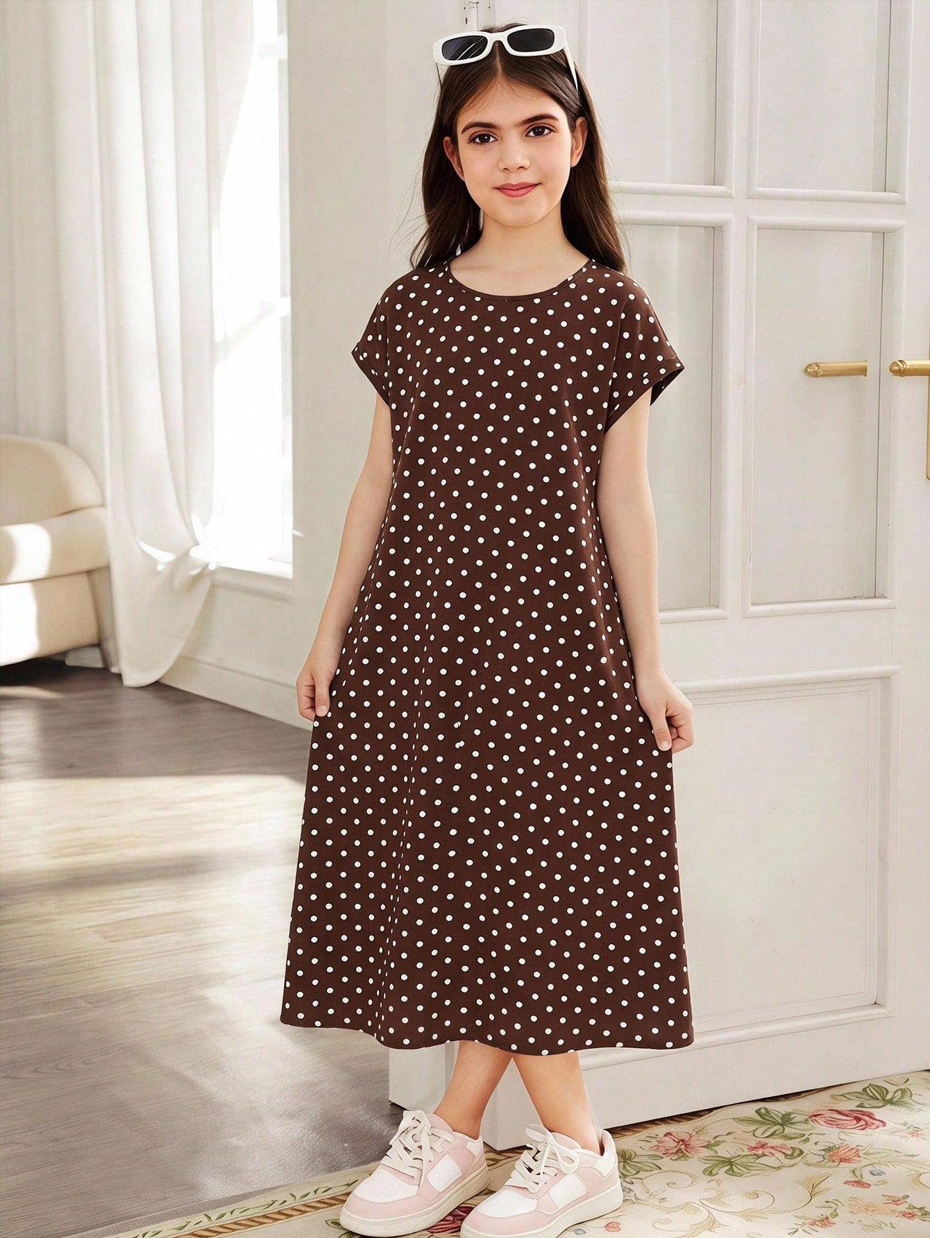 Tween girls casual black A-line long dress featuring short sleeves, a round neckline, and a decorative front bow with contrast lace trim.