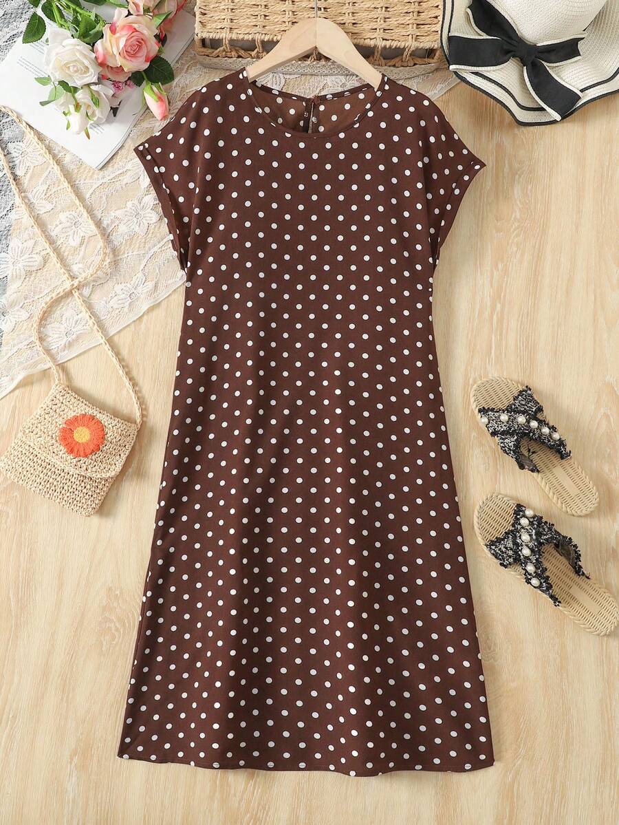 Tween girls casual black A-line long dress featuring short sleeves, a round neckline, and a decorative front bow with contrast lace trim.