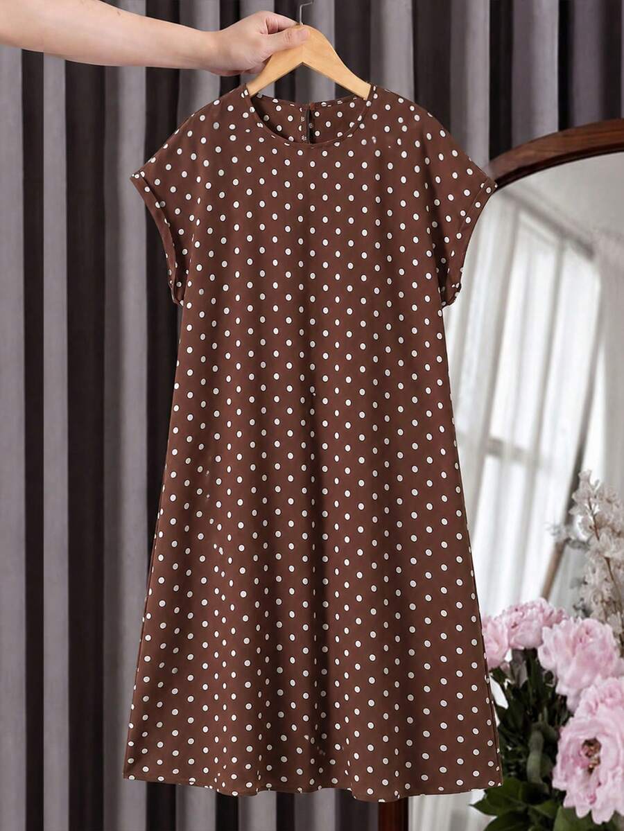 Tween girls casual black A-line long dress featuring short sleeves, a round neckline, and a decorative front bow with contrast lace trim.