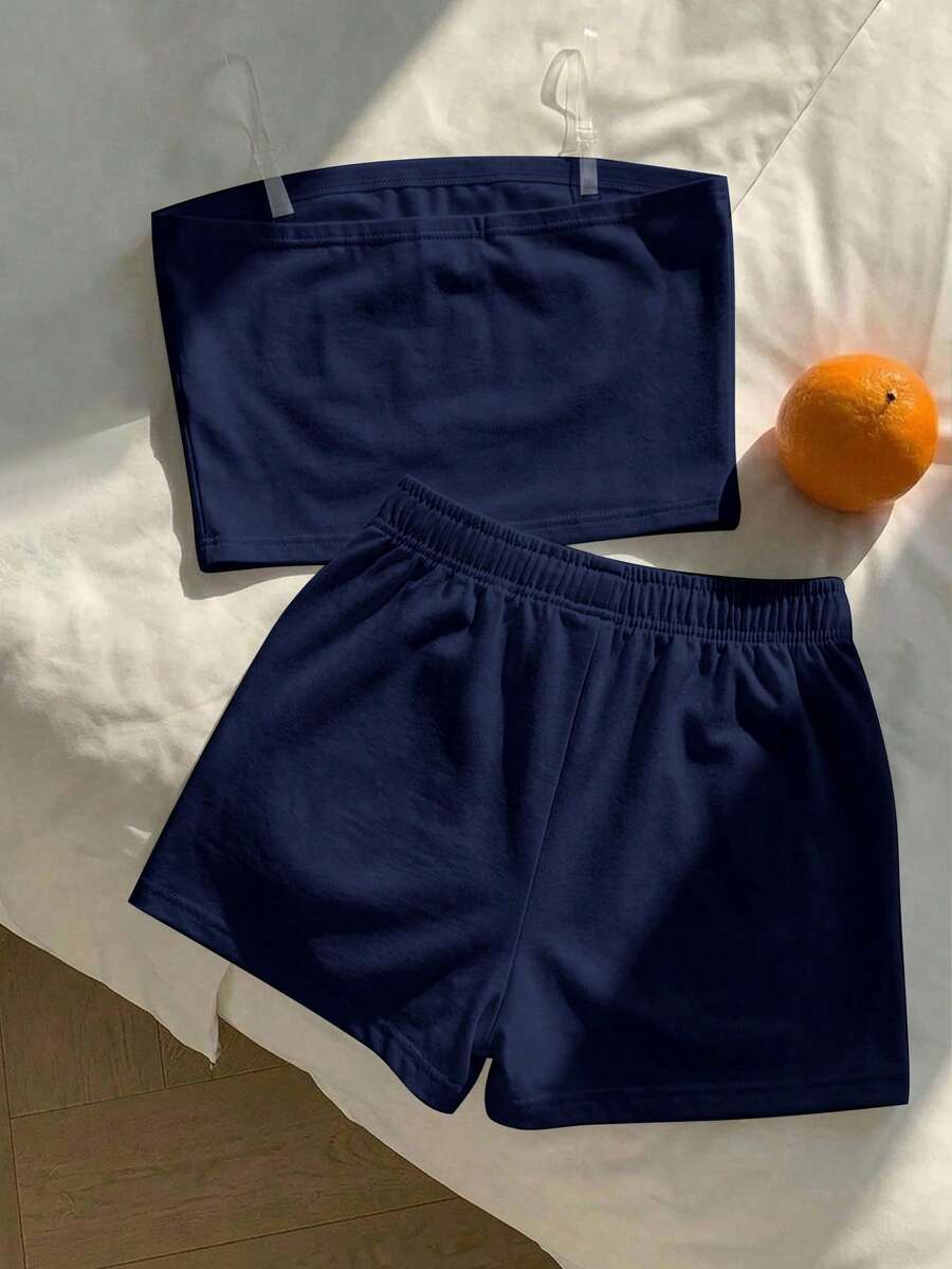 Tween girls two-piece summer outfit featuring a brown strapless tube top with contrast pink tape accent and matching brown shorts with pockets.