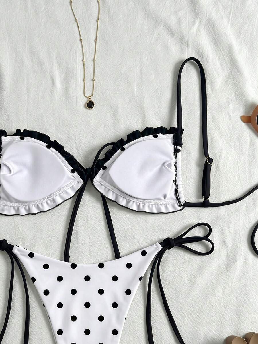 Women's beige two-piece bikini set featuring a wireless top with removable padding, spaghetti straps, tie back detail, and low waist hipster swimsuit bottoms.