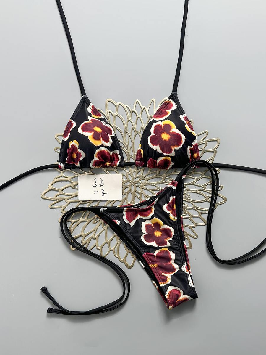 Women's black halter bikini set featuring triangle cups with gold bead decor and tie-back closure