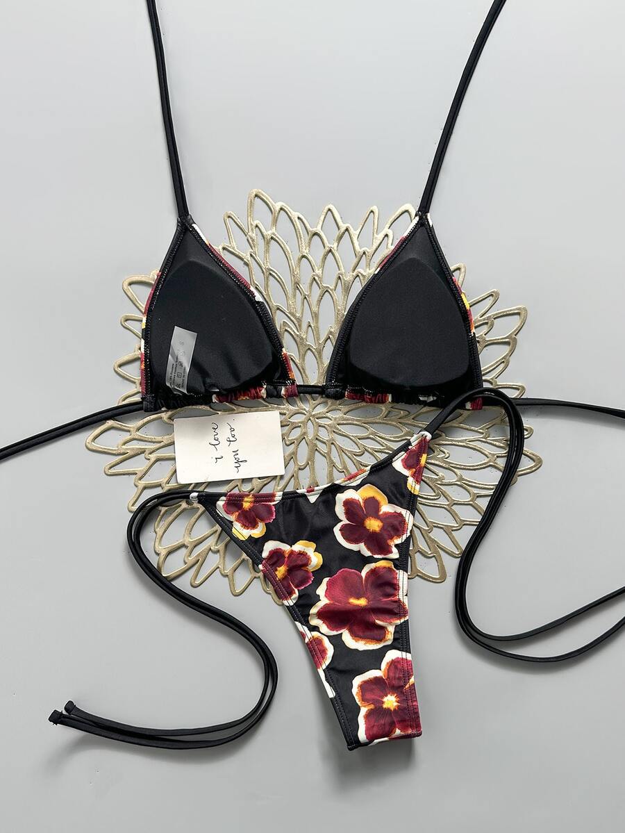 Women's black halter bikini set featuring triangle cups with gold bead decor and tie-back closure