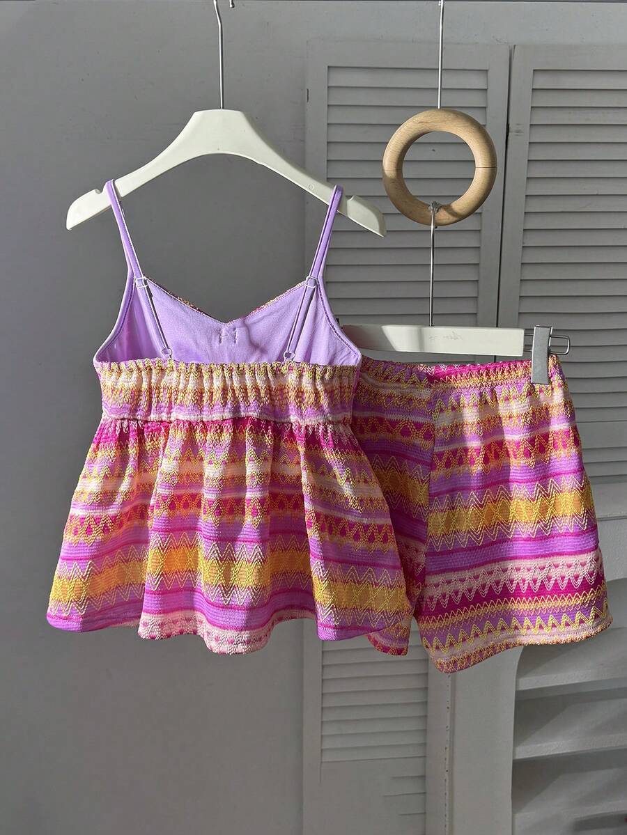 Tween girls 2-piece summer vacation set featuring a multicolored geometric print sleeveless camisole top with bow knot detail and matching elastic waist shorts.