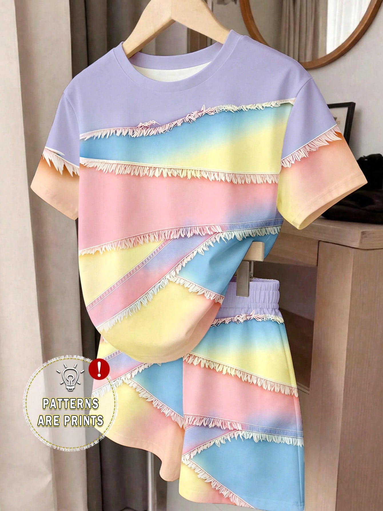 Girls' multicolor short sleeve T-shirt and shorts set featuring a cute cherry and bow print with round neck top and matching shorts.