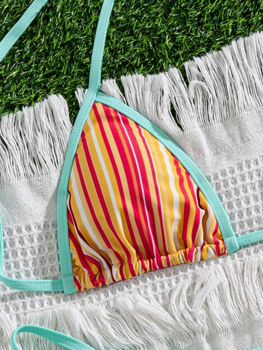 Women's two-piece halter triangle bikini set featuring a backless tie-back top with removable padding and matching tie-side mid-waist bottoms.