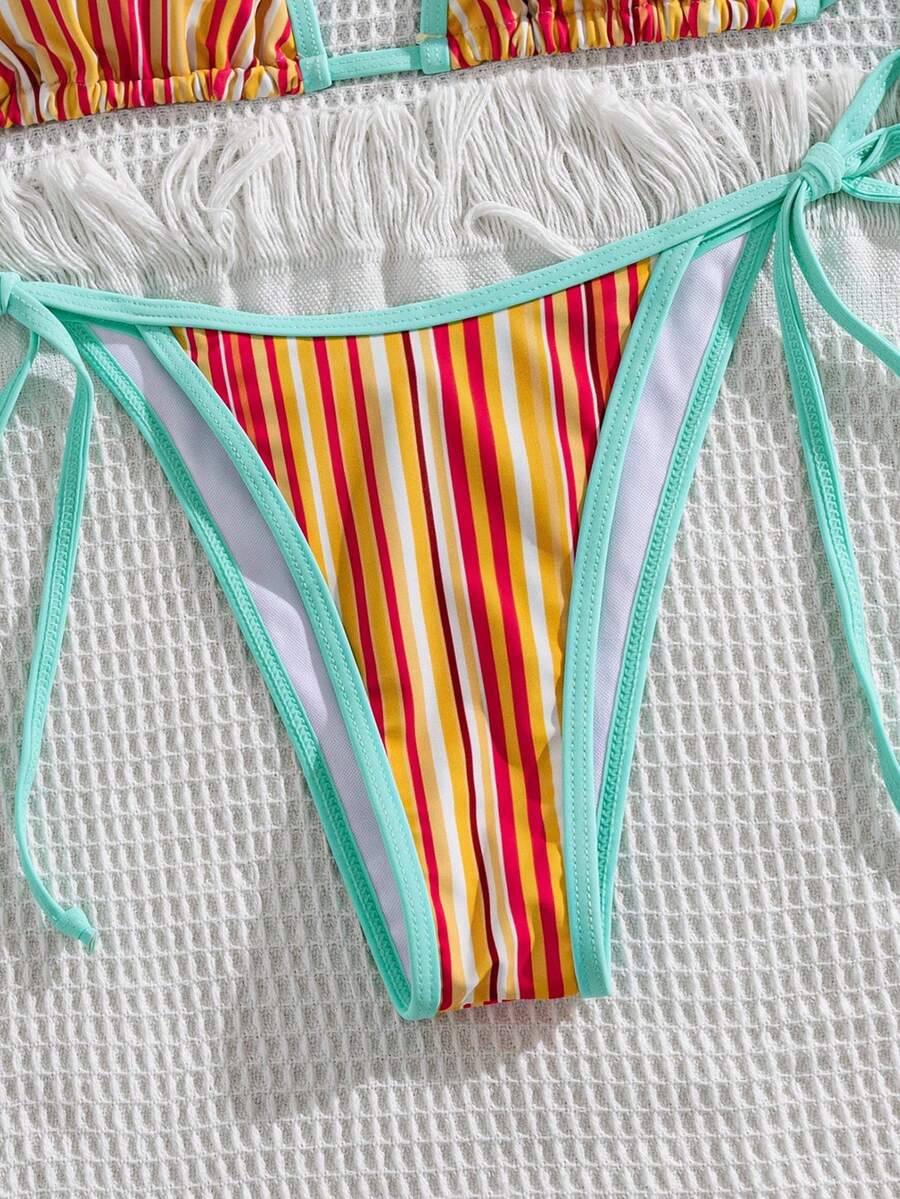 Women's two-piece halter triangle bikini set featuring a backless tie-back top with removable padding and matching tie-side mid-waist bottoms.