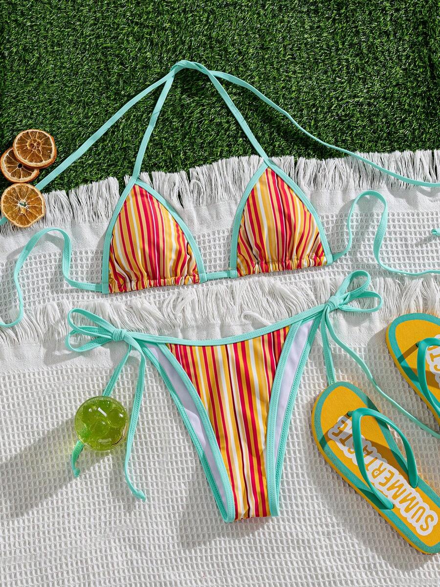 Women's two-piece halter triangle bikini set featuring a backless tie-back top with removable padding and matching tie-side mid-waist bottoms.