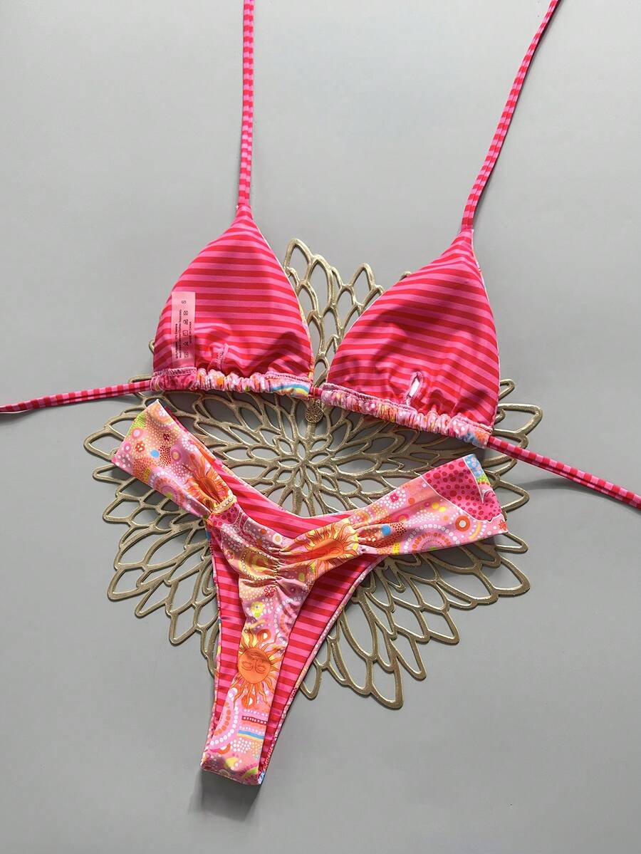 Women's 2-piece triangle cup bikini set in solid color featuring woven pearl shell decoration, halter neckline, and high-waist side-tie ruched bottoms.