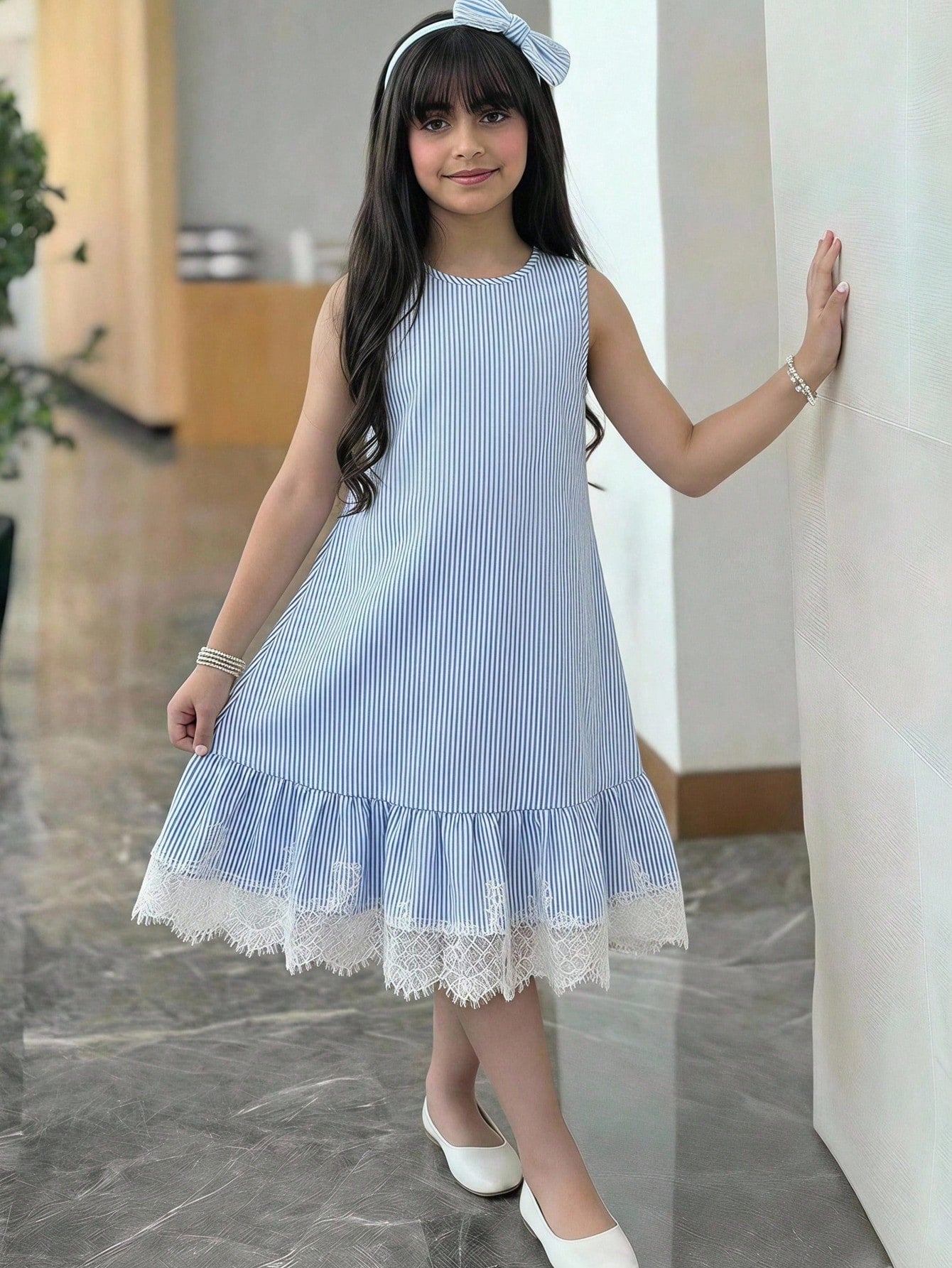 Tween girls sleeveless halter tunic dress with colorful rainbow striped colorblock pattern, button detail, short length, and regular fit for summer vacation or beach wear.