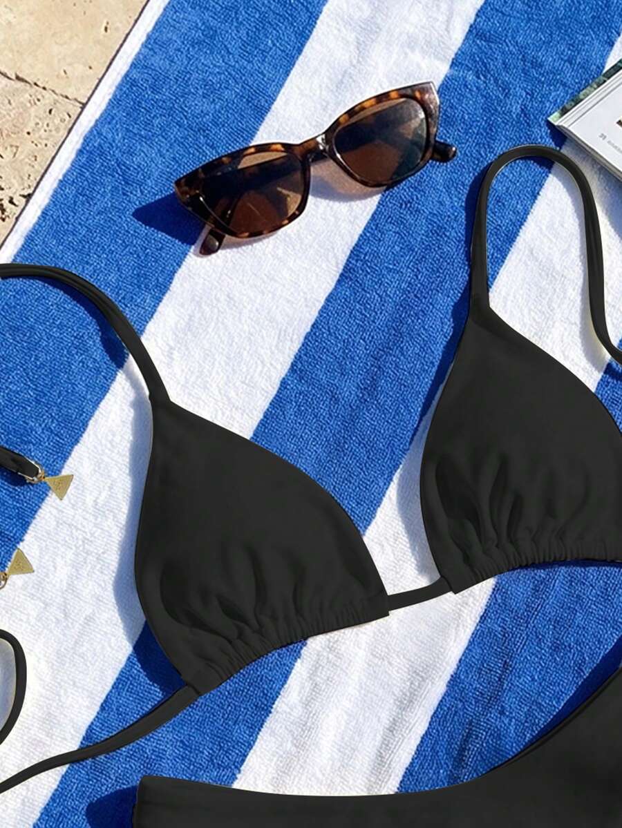 Women's two-piece halter bikini set featuring high cut thong bottoms and removable padding