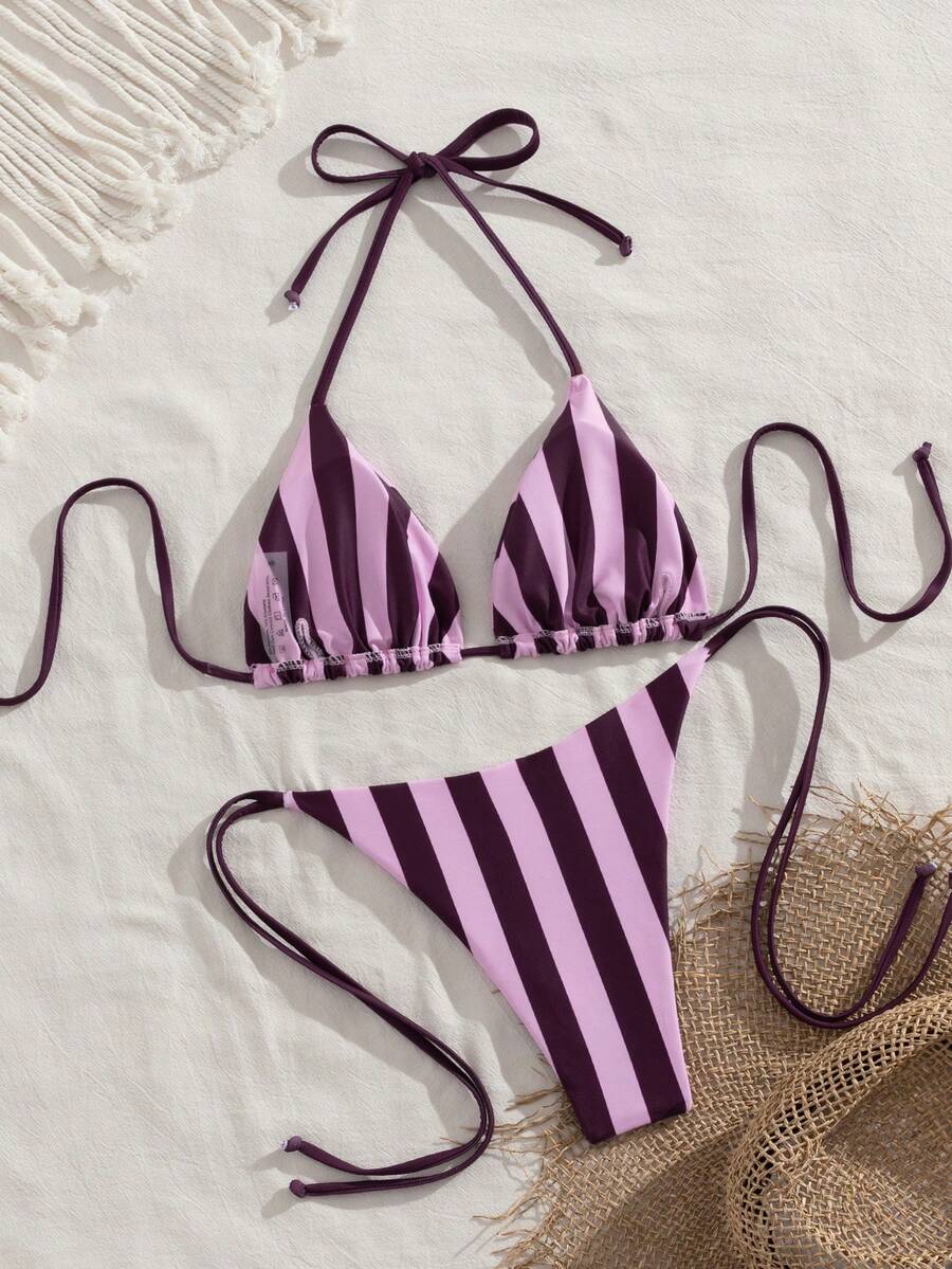 Multicolor striped halter neck two-piece bikini set featuring wireless triangle cups and low-waist tie-side bottoms.