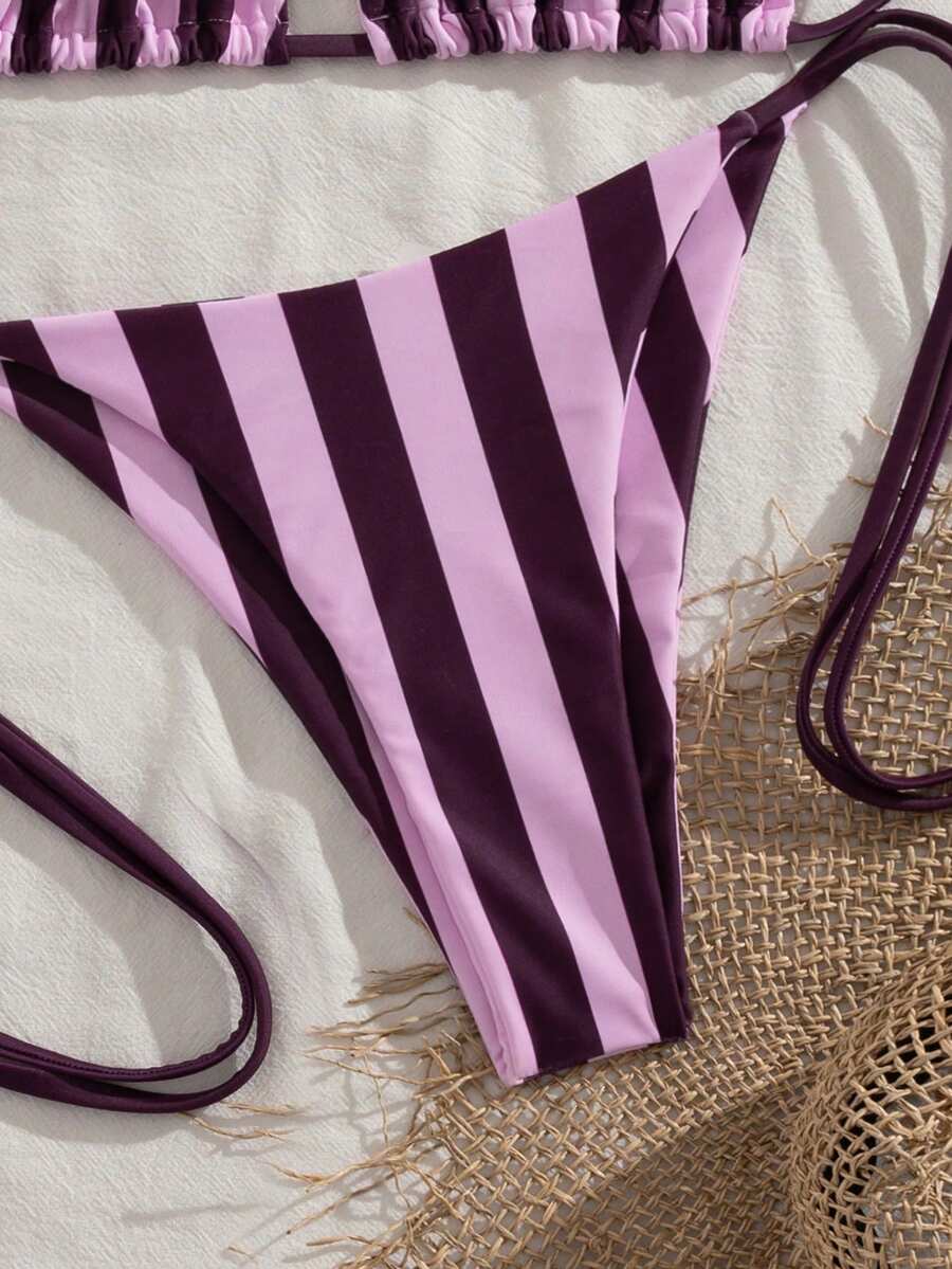 Multicolor striped halter neck two-piece bikini set featuring wireless triangle cups and low-waist tie-side bottoms.