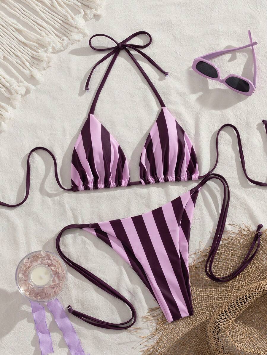 Multicolor striped halter neck two-piece bikini set featuring wireless triangle cups and low-waist tie-side bottoms.