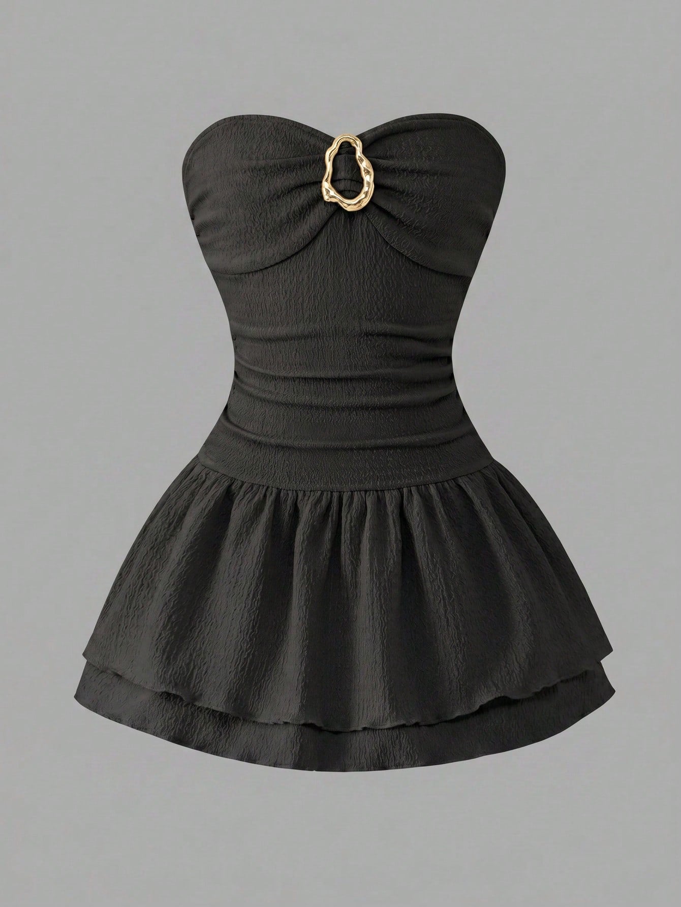 Tween girl black mini dress with halter neckline, backless design, tiered layer detail, high waist, flounce hem, and sleeveless slim fit.