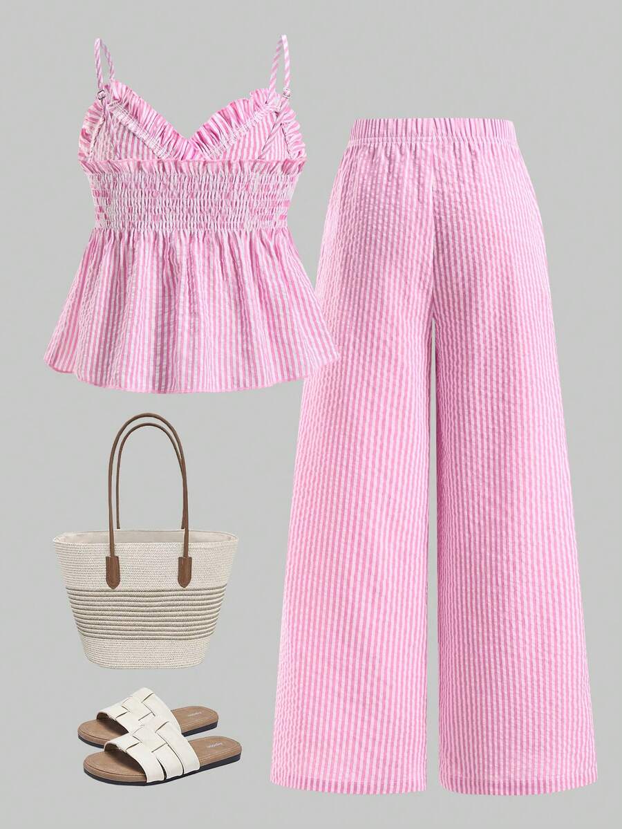 Tween girls 2-piece set featuring a short V-neck ruffle camisole top and matching long pants made of bubble crinkle fabric.