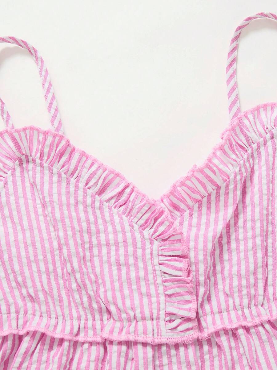 Tween girls 2-piece set featuring a short V-neck ruffle camisole top and matching long pants made of bubble crinkle fabric.