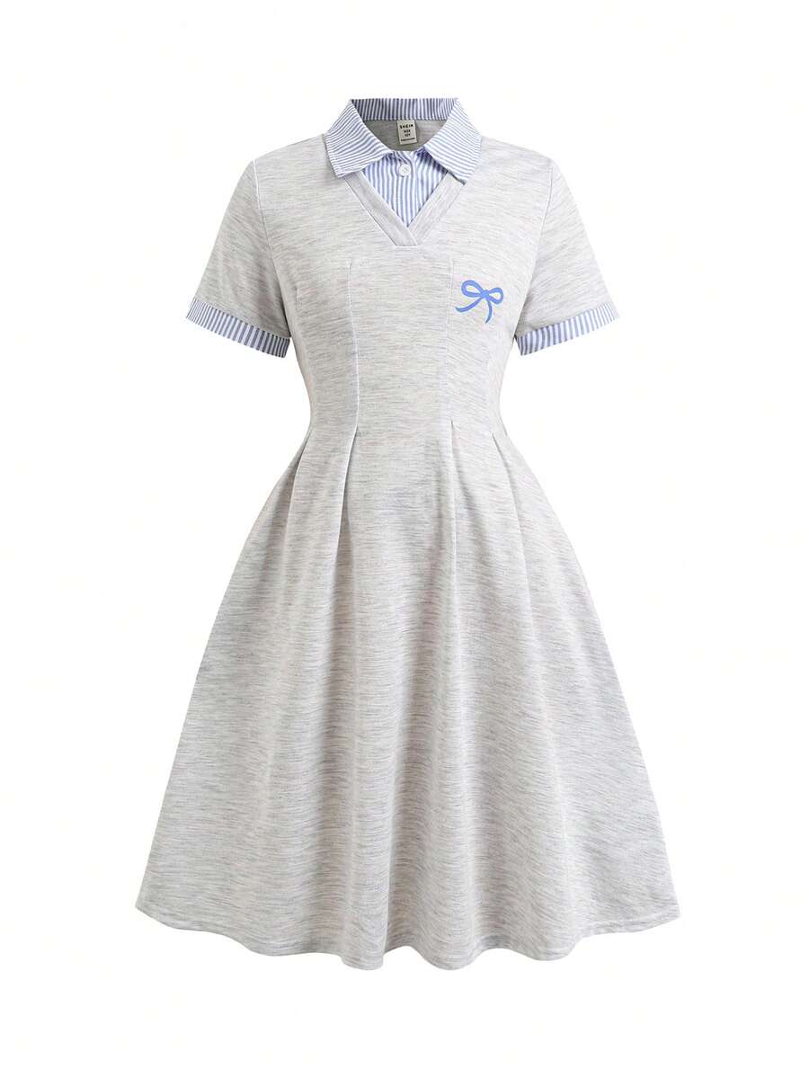 Tween girl wearing an apricot short sleeve A-line dress featuring a round neck, high waist with a belt, and flared hem.