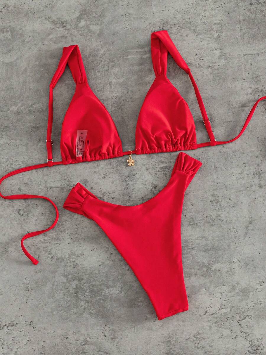 Women's solid yellow 2-piece bikini set featuring a high-waist bottom and a wireless bandeau top on display for beach and resort wear.