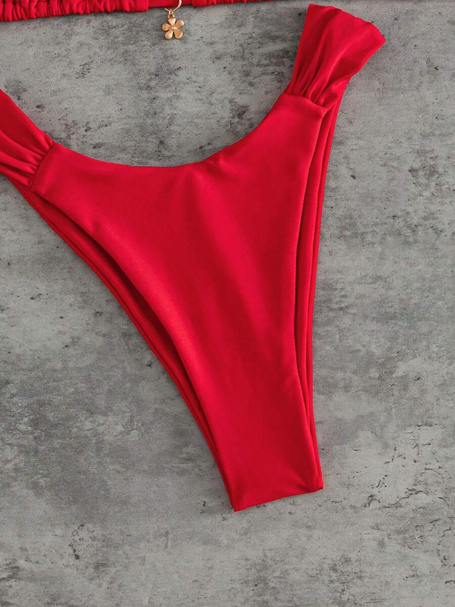 Women's solid yellow 2-piece bikini set featuring a high-waist bottom and a wireless bandeau top on display for beach and resort wear.
