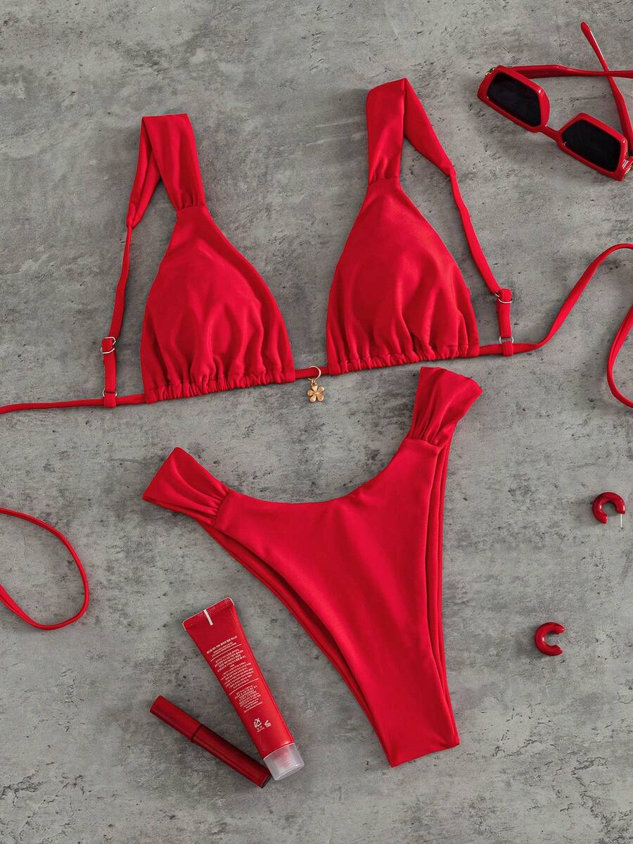 Women's solid yellow 2-piece bikini set featuring a high-waist bottom and a wireless bandeau top on display for beach and resort wear.