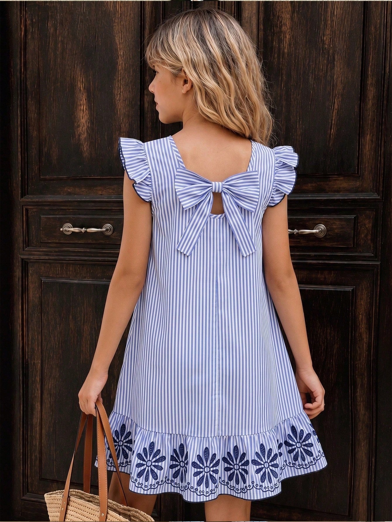Tween girls apricot vacation midi dress featuring a round neck, cut out details, ruffle flounce accents, and geometric pattern.