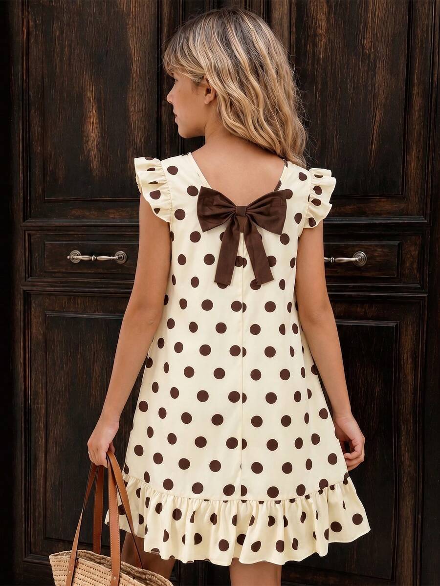 Tween girls apricot vacation midi dress featuring a round neck, cut out details, ruffle flounce accents, and geometric pattern.