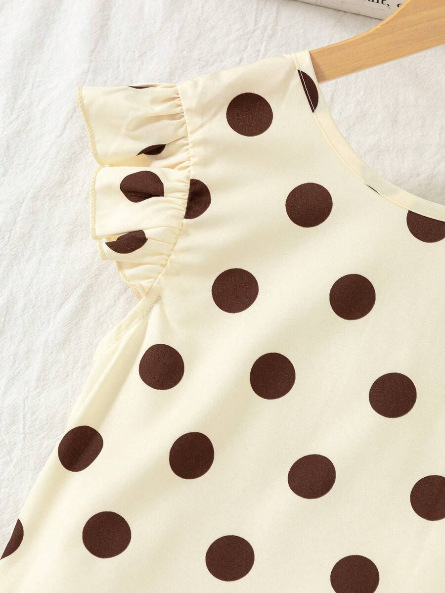 Tween girls apricot vacation midi dress featuring a round neck, cut out details, ruffle flounce accents, and geometric pattern.