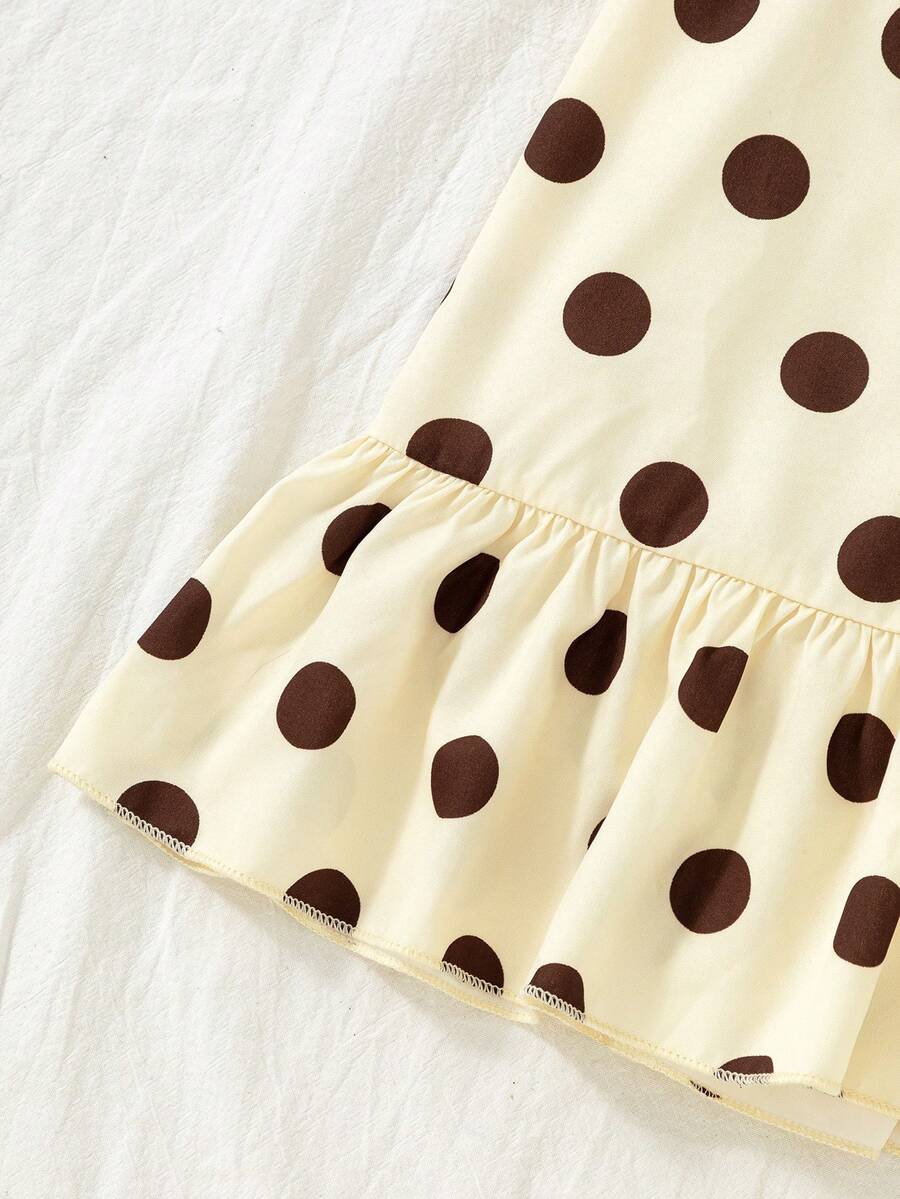 Tween girls apricot vacation midi dress featuring a round neck, cut out details, ruffle flounce accents, and geometric pattern.