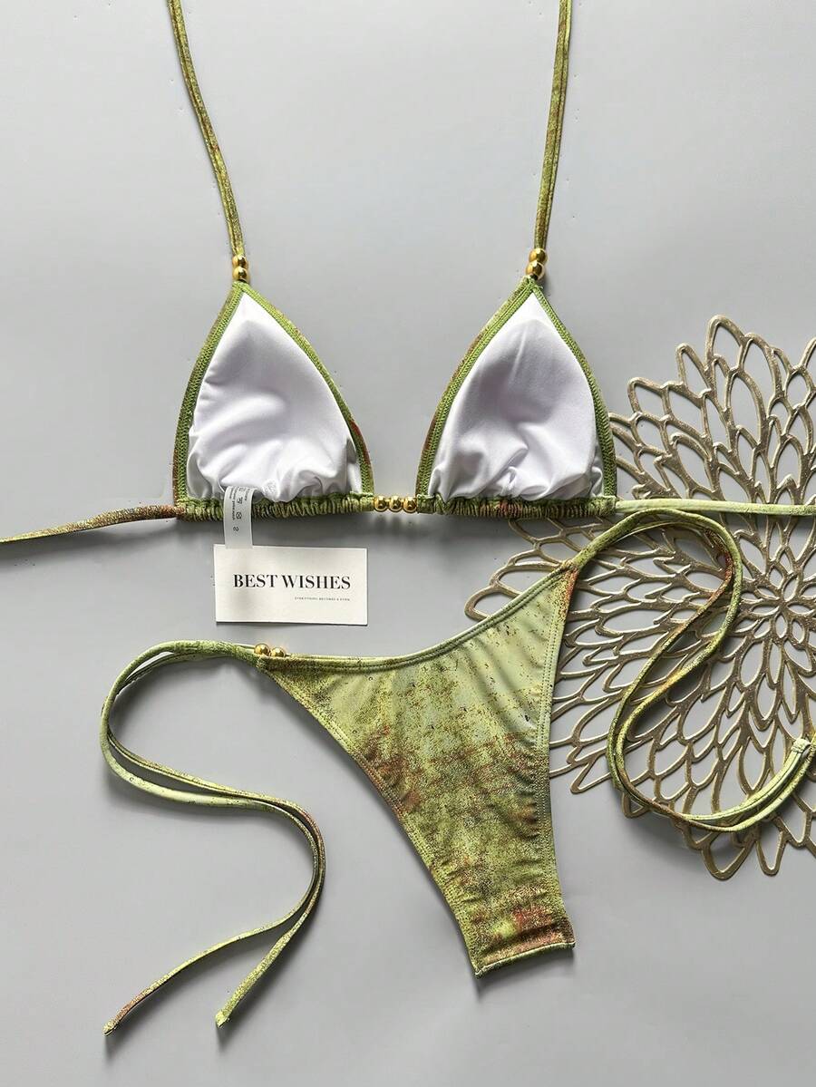 Women's black halter bikini set featuring triangle cups with gold bead decor and tie-back closure