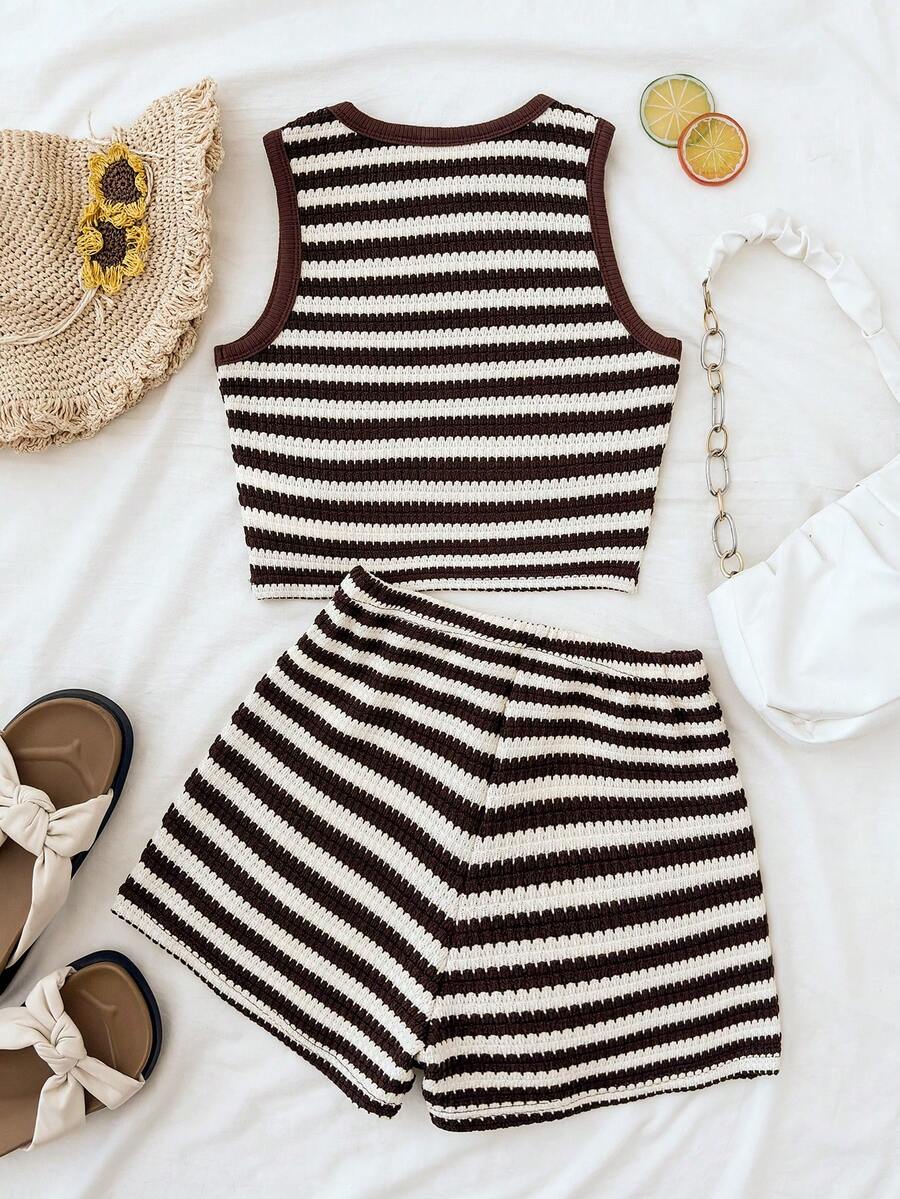 Tween girls black and white two-piece casual summer outfit featuring a rib-knit cropped top with round neck and matching shorts with contrast piping.