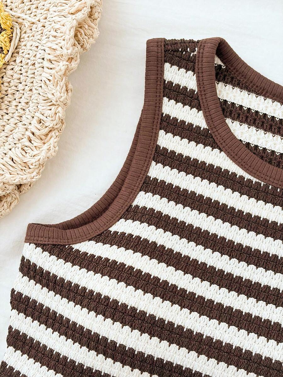 Tween girls black and white two-piece casual summer outfit featuring a rib-knit cropped top with round neck and matching shorts with contrast piping.