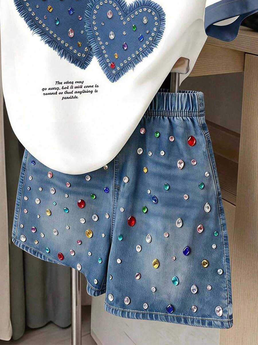 Girls' multicolor short sleeve T-shirt and shorts set featuring a cute cherry and bow print with round neck top and matching shorts.