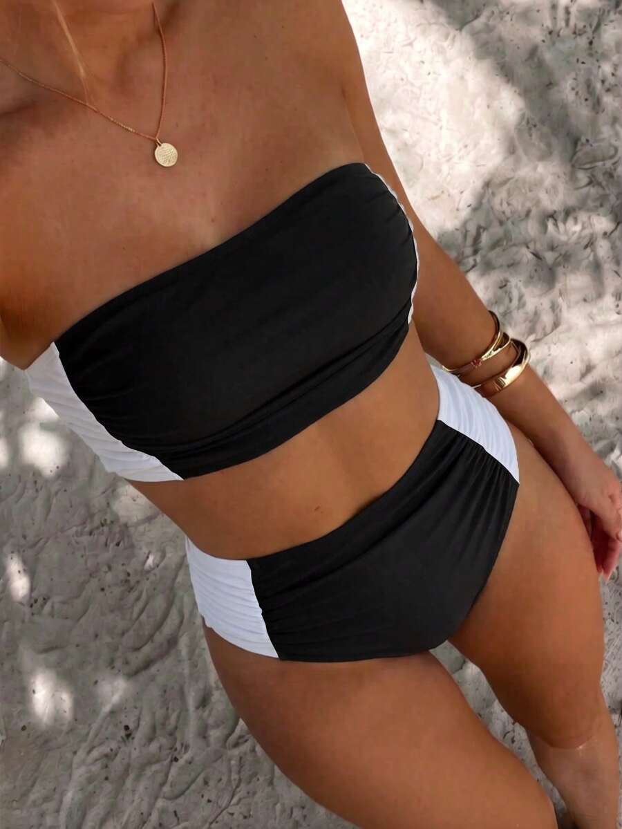 Women's black strapless ruched bandeau bikini top with high waisted bottoms