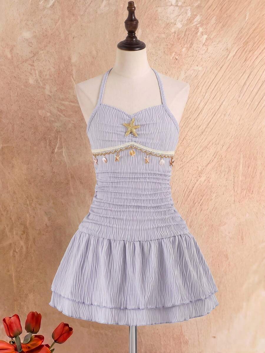 Tween girls apricot sleeveless halter mini dress with textured starfish and shell decor, shirred tiered layer, high waist, and flounce hem.
