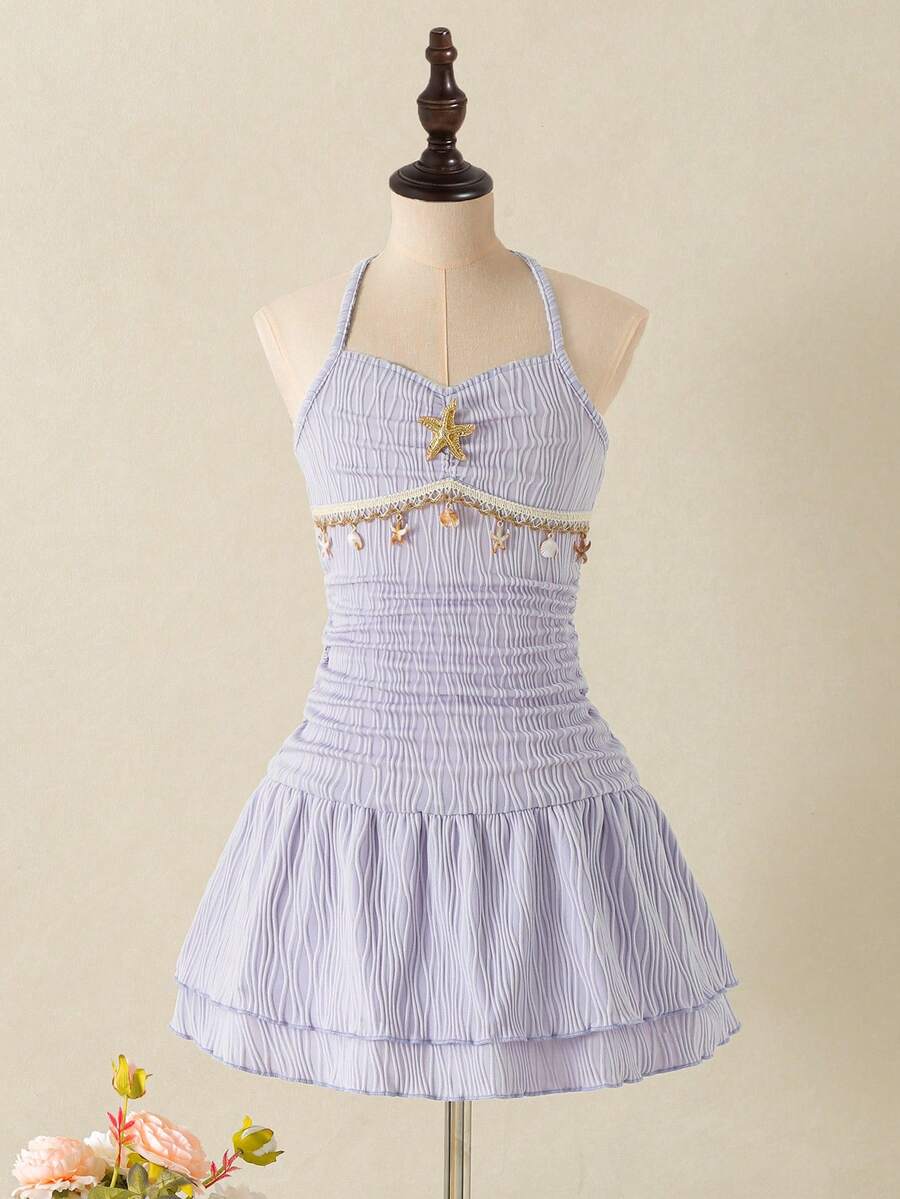 Tween girls apricot sleeveless halter mini dress with textured starfish and shell decor, shirred tiered layer, high waist, and flounce hem.