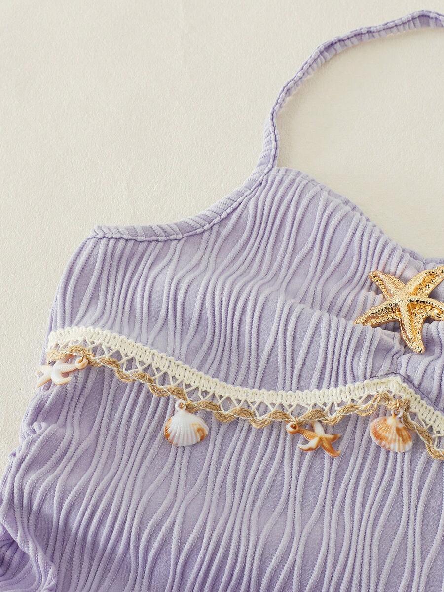 Tween girls apricot sleeveless halter mini dress with textured starfish and shell decor, shirred tiered layer, high waist, and flounce hem.