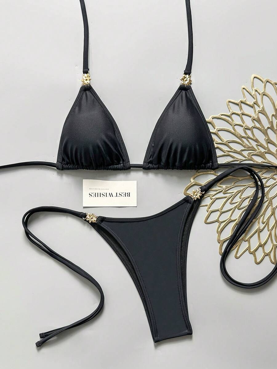 Women's black halter bikini set featuring triangle cups with gold bead decor and tie-back closure