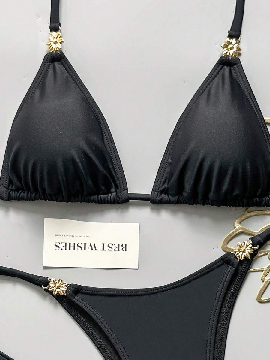 Women's black halter bikini set featuring triangle cups with gold bead decor and tie-back closure