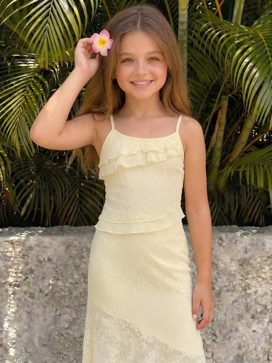 Tween girls blue 2-piece set featuring a short spaghetti strap lace tank top with asymmetrical lettuce trim and a long matching skirt.