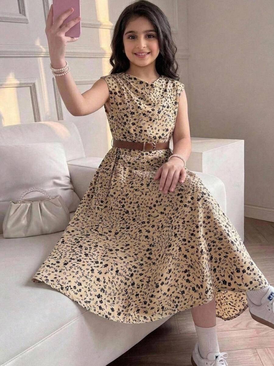 Tween girl wearing an apricot plant print long dress featuring a stand collar, short sleeves, high waist, flared hem, and back zipper closure.