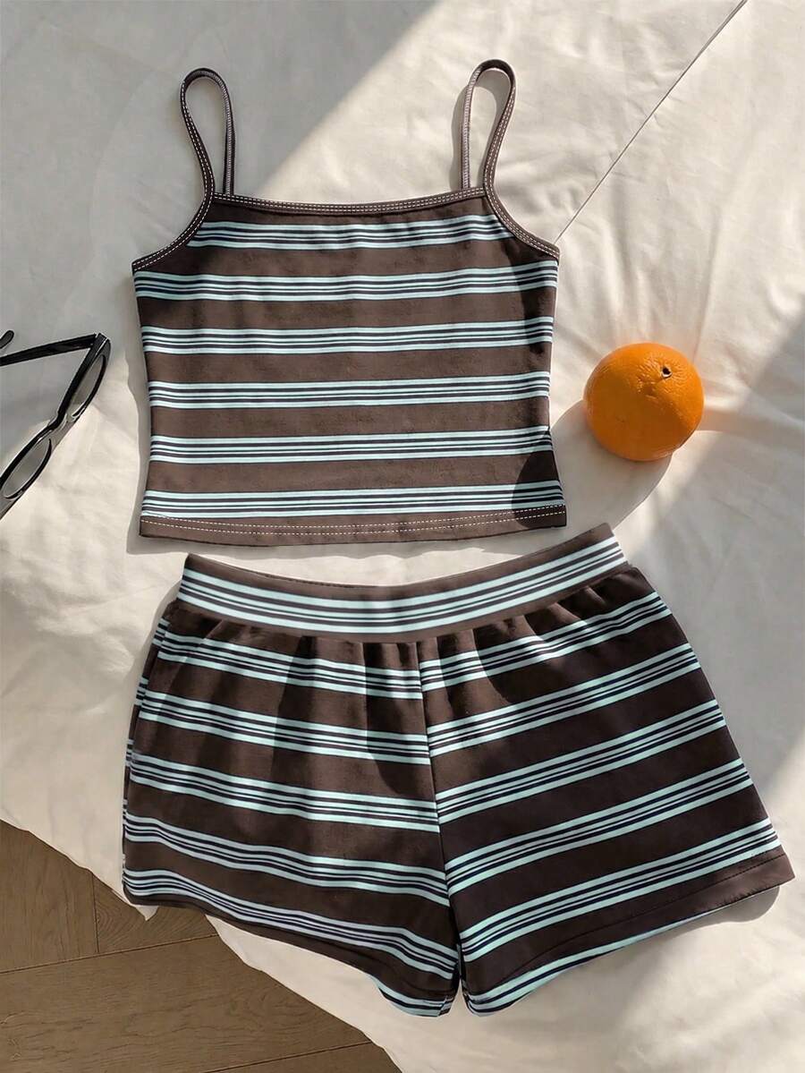 Tween girls summer 2-piece Hawaiian style outfit featuring a graphic print spaghetti strap camisole top with contrast piping and matching casual shorts.