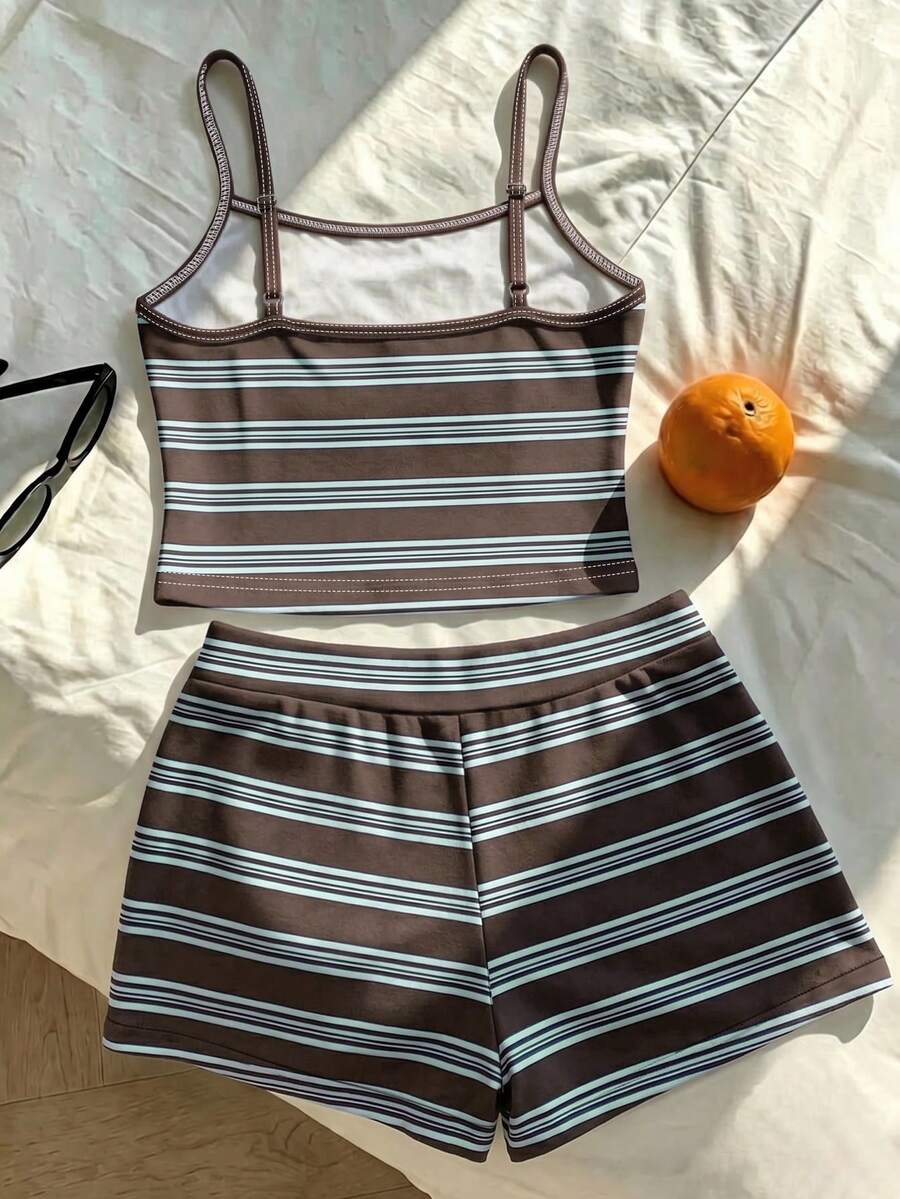 Tween girls summer 2-piece Hawaiian style outfit featuring a graphic print spaghetti strap camisole top with contrast piping and matching casual shorts.