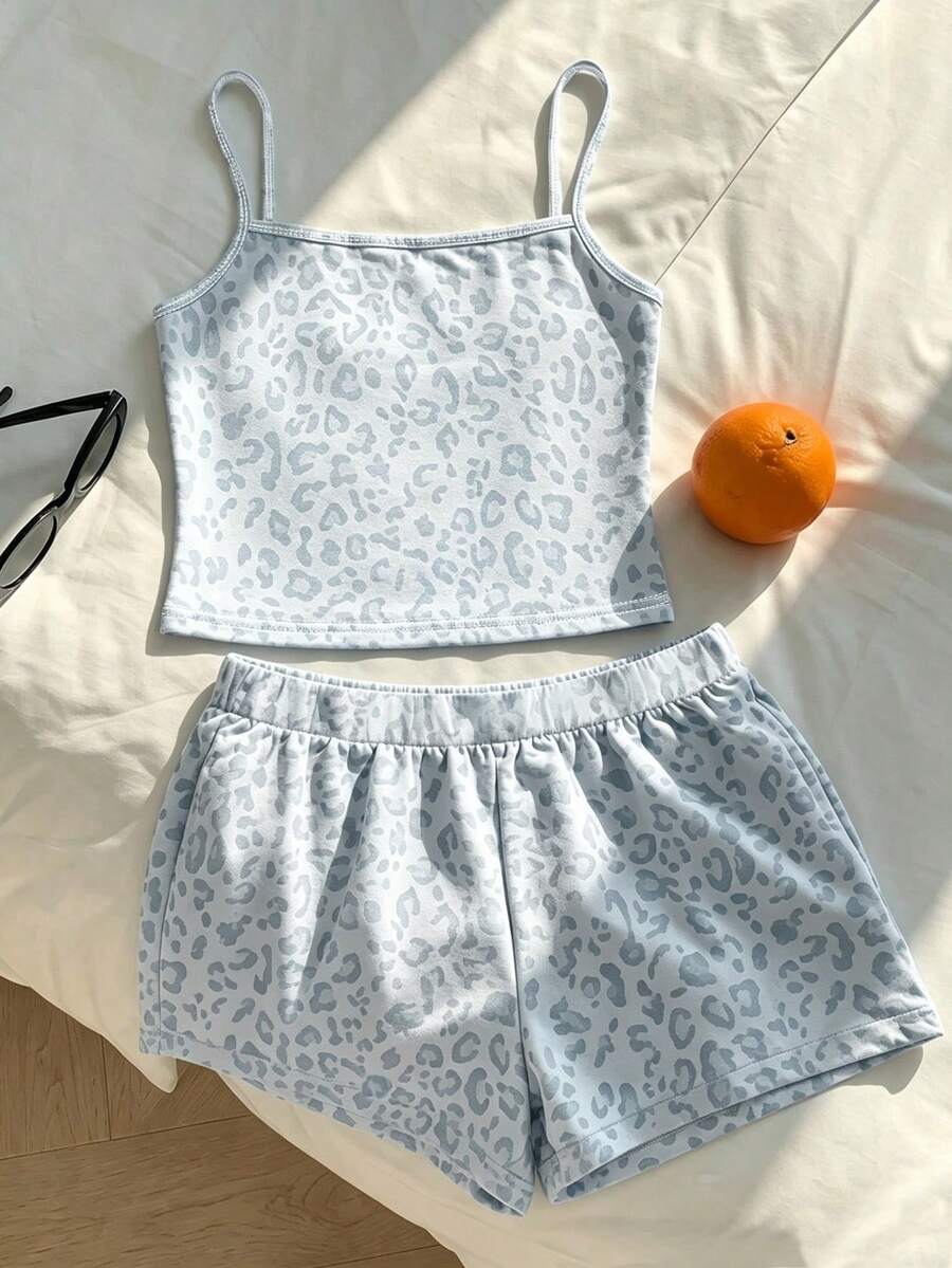 Tween girls summer 2-piece Hawaiian style outfit featuring a graphic print spaghetti strap camisole top with contrast piping and matching casual shorts.