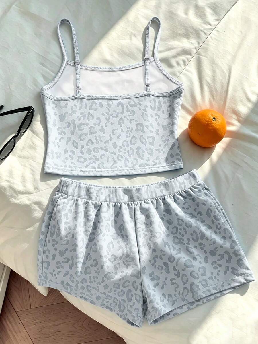 Tween girls summer 2-piece Hawaiian style outfit featuring a graphic print spaghetti strap camisole top with contrast piping and matching casual shorts.