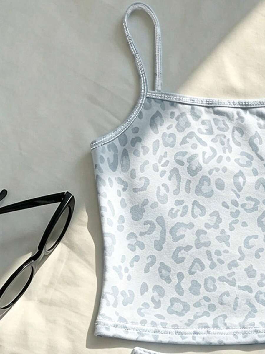 Tween girls summer 2-piece Hawaiian style outfit featuring a graphic print spaghetti strap camisole top with contrast piping and matching casual shorts.