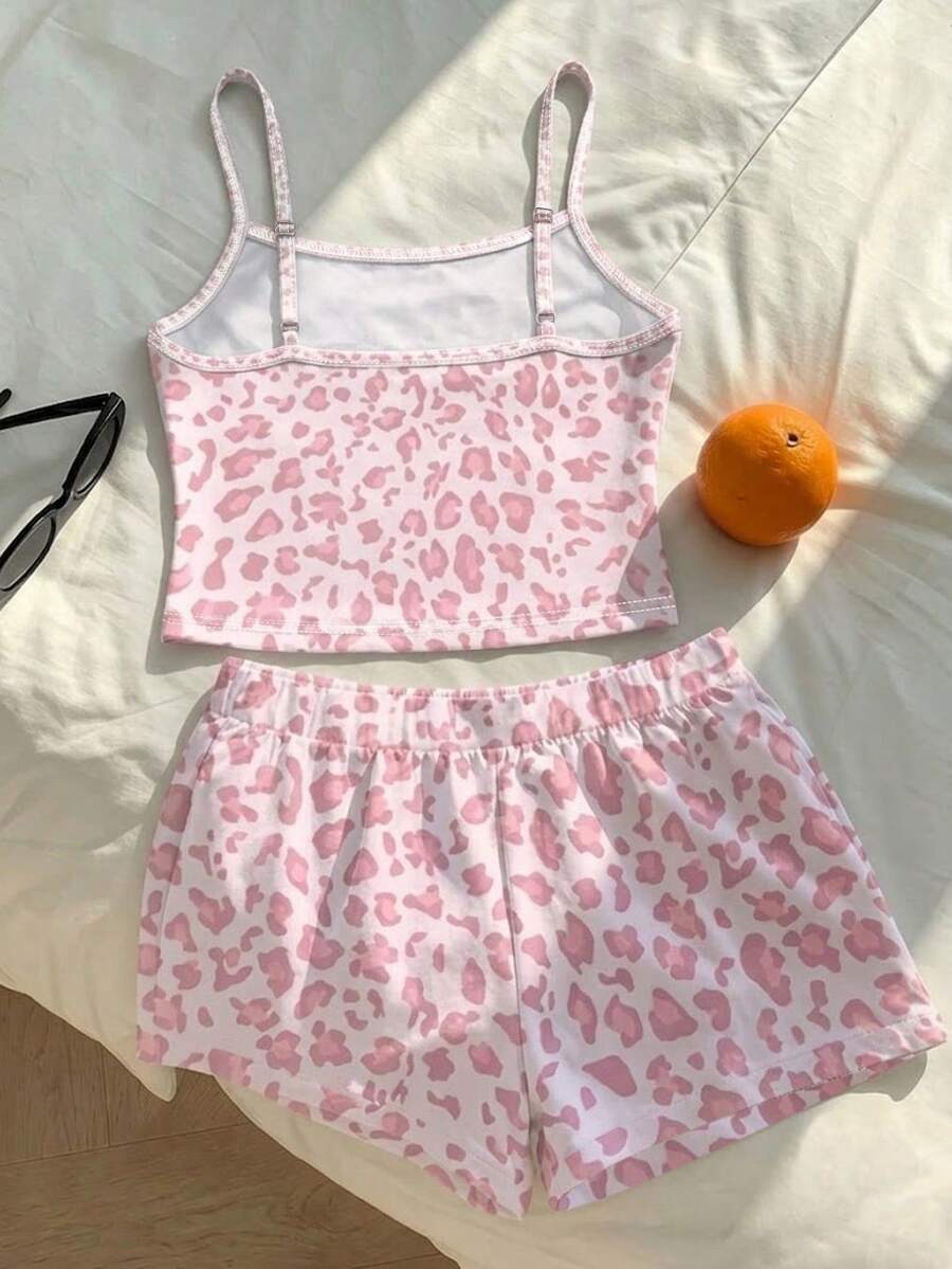 Tween girls summer 2-piece Hawaiian style outfit featuring a graphic print spaghetti strap camisole top with contrast piping and matching casual shorts.