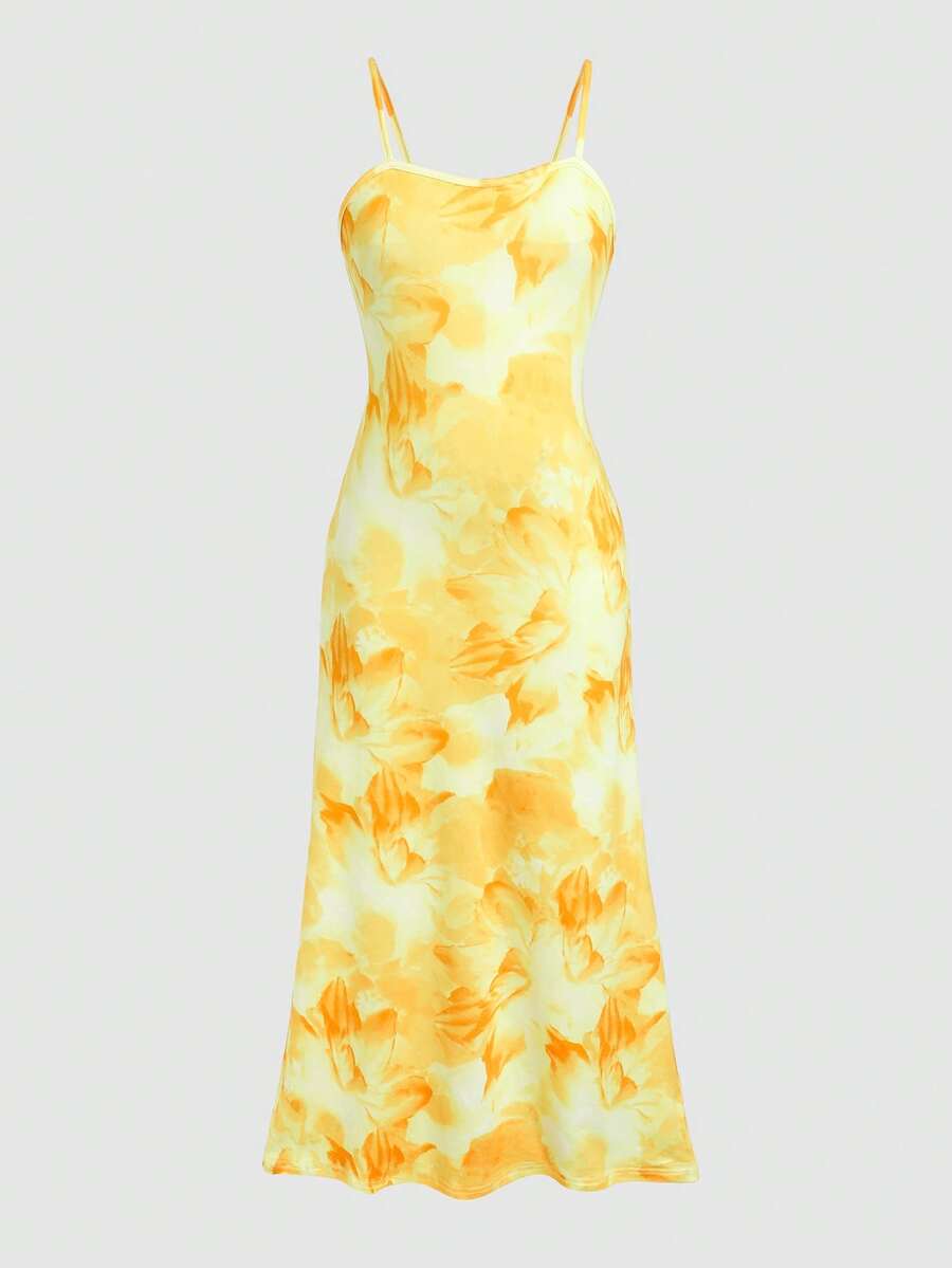 Tween girls black cami midi dress featuring plant print, spaghetti straps, slim fit, and a flared hem.